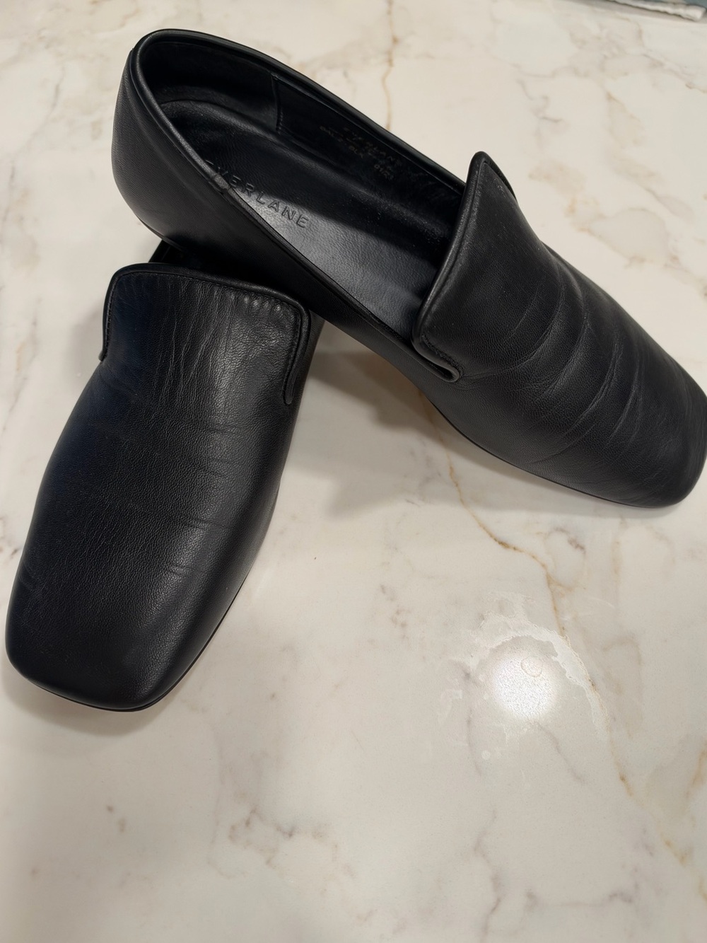 Everlane Black Leather Slip-On Loafers.